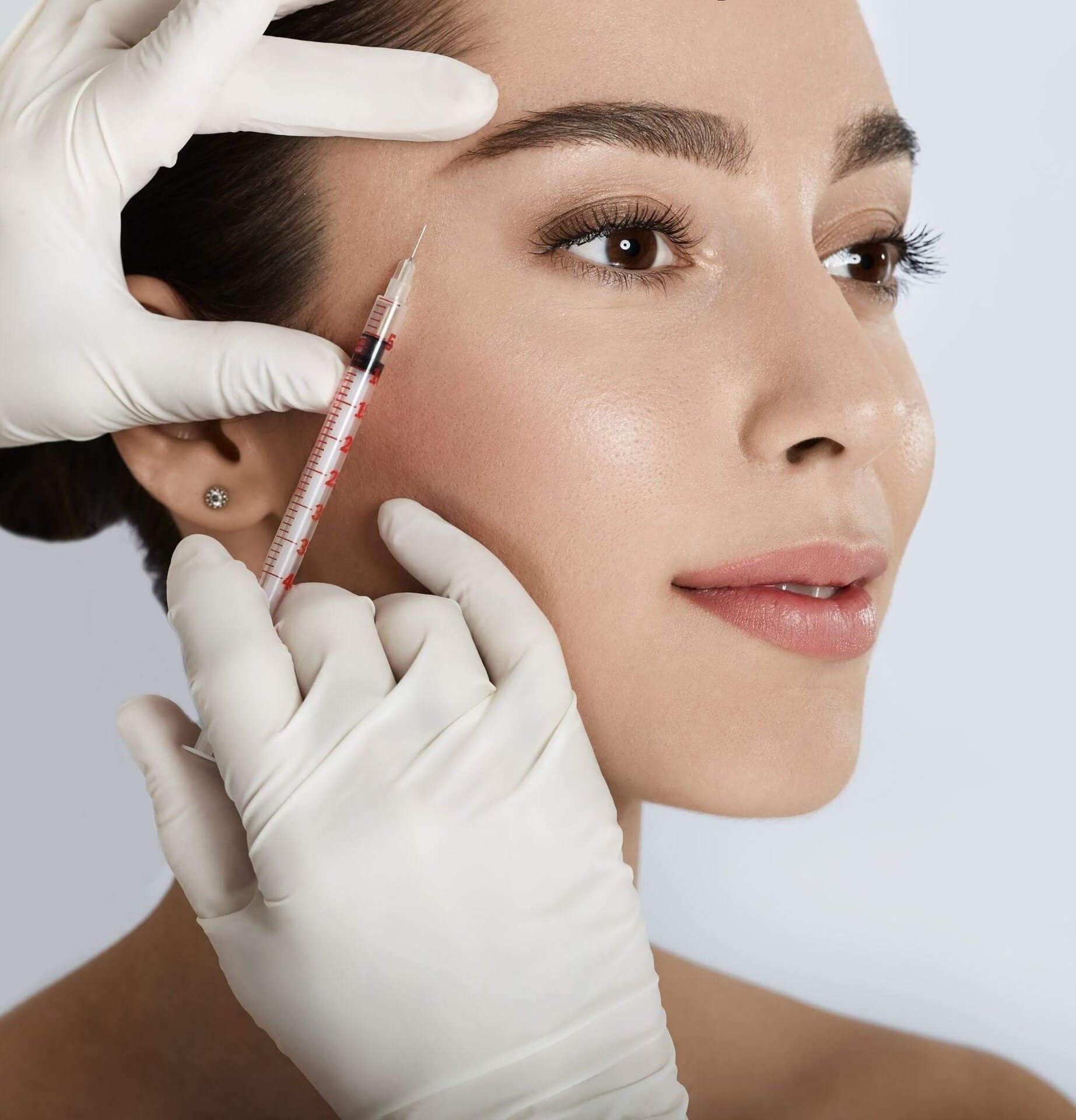 Woman receiving a cosmetic injection for wrinkle treatment at My Cosmetic Clinic.