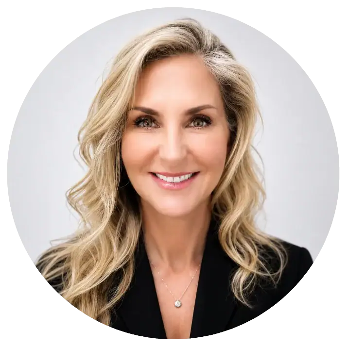 Professional woman with blonde hair smiling, representing My Cosmetic Clinic team.