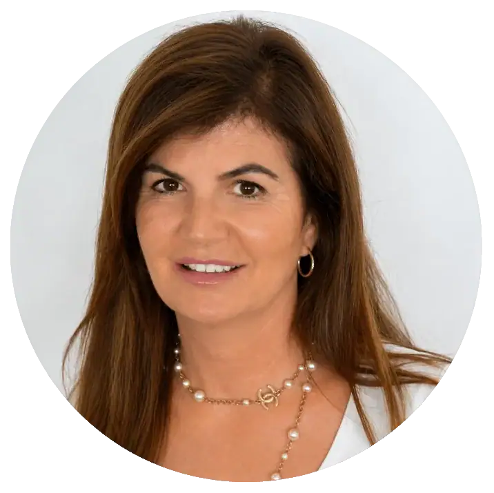 Professional woman with brown hair and pearl necklace at My Cosmetic Clinic.